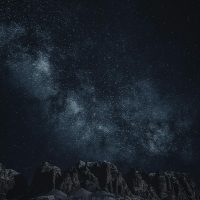 Star-filled night sky over mountains Starry sky with Milky Way over mountains